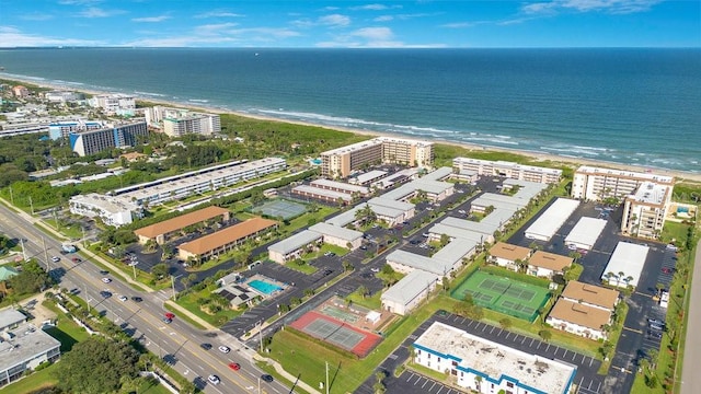 drone / aerial view with a view of the beach and a water view