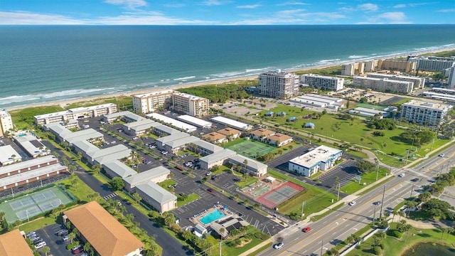 bird's eye view featuring a water view and a view of the beach