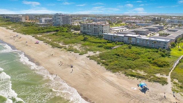 aerial view featuring a view of the beach and a water view