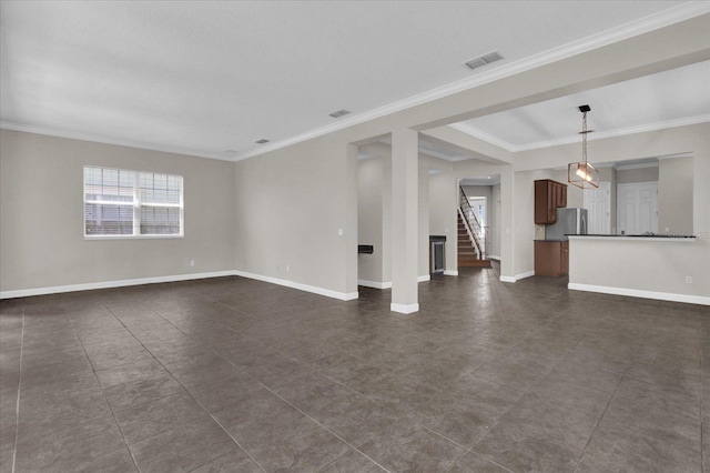 unfurnished living room with crown molding