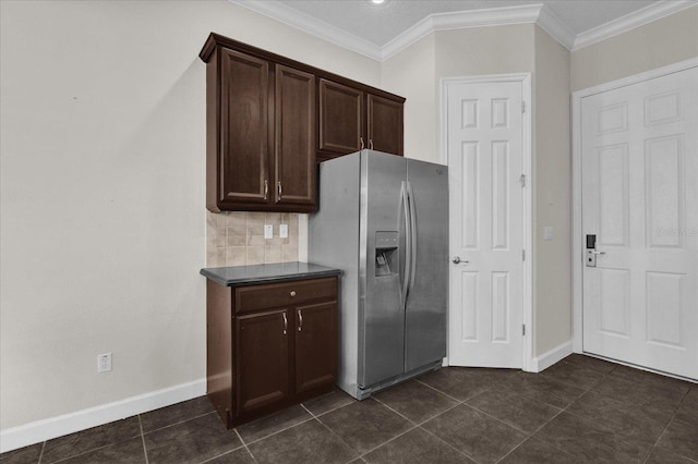 kitchen with crown molding, dark brown cabinetry, stainless steel fridge with ice dispenser, and dark tile patterned flooring