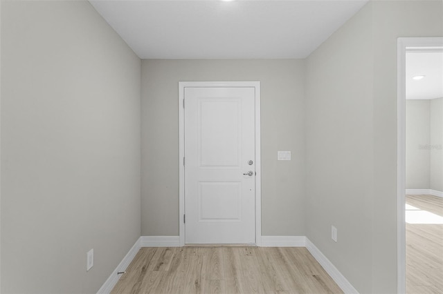 unfurnished room with light hardwood / wood-style flooring