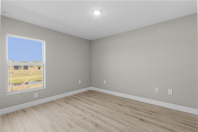 spare room featuring light hardwood / wood-style flooring