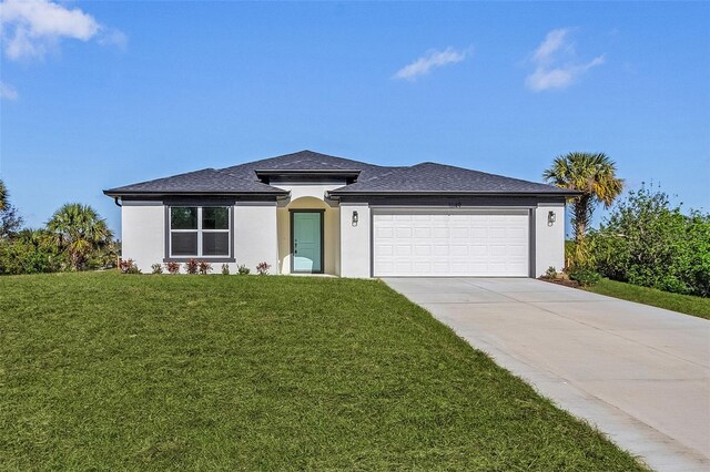 3841 San Pedro Ave, North Port, FL 34288 - prairie-style home featuring concrete driveway, a front yard, stucco siding, and an attached garage