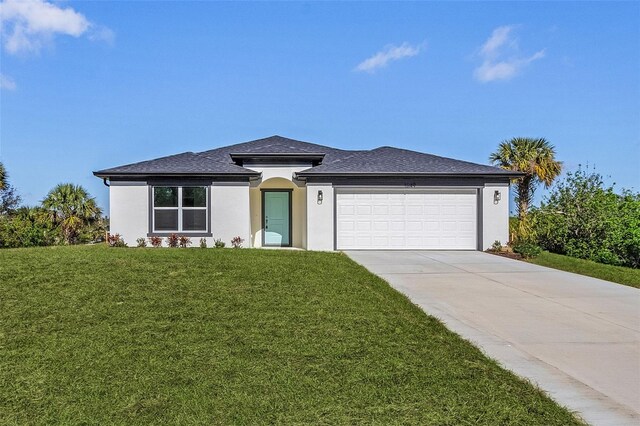 view of front facade with a front lawn and a garage