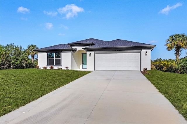 view of front of house with a front yard and a garage