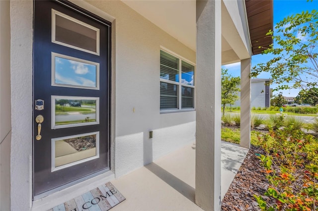 entrance to property with a porch