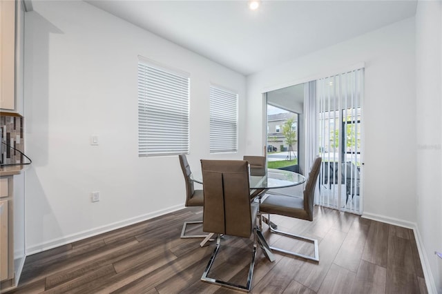 dining space featuring dark hardwood / wood-style flooring