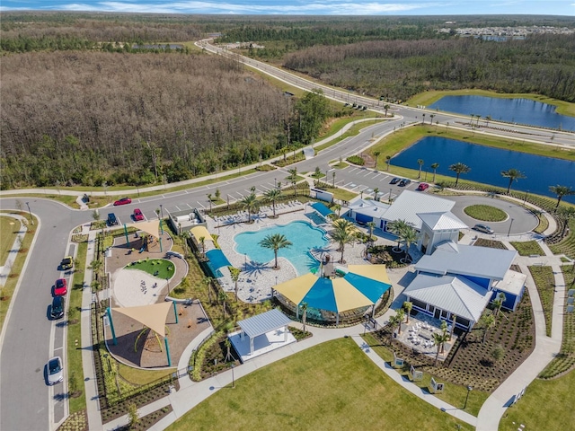 birds eye view of property with a water view