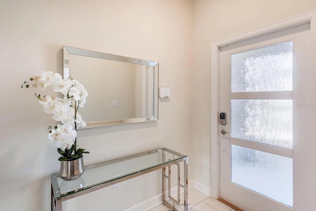 entryway with light tile patterned floors