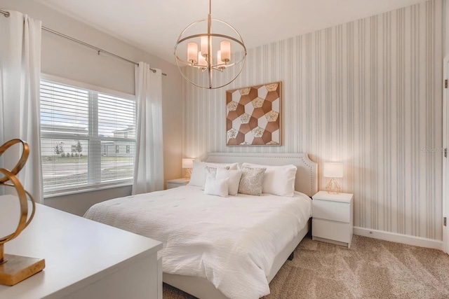 bedroom with light colored carpet and a notable chandelier