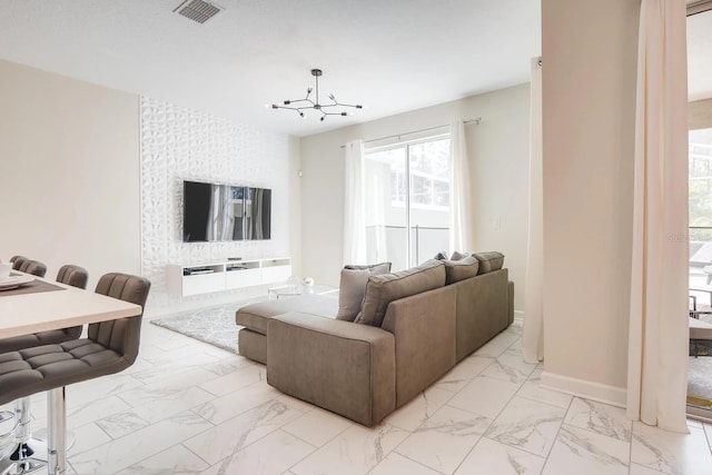 living room featuring a chandelier