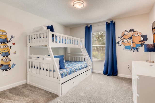 bedroom featuring carpet and a textured ceiling