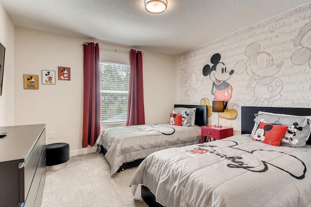 bedroom with a textured ceiling and carpet floors