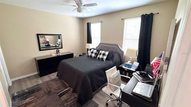 bedroom with light hardwood / wood-style floors and ceiling fan