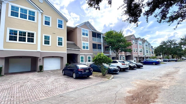 view of building exterior with cooling unit and a garage