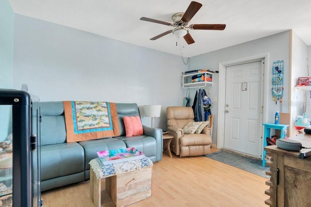 living area with ceiling fan and light wood-type flooring