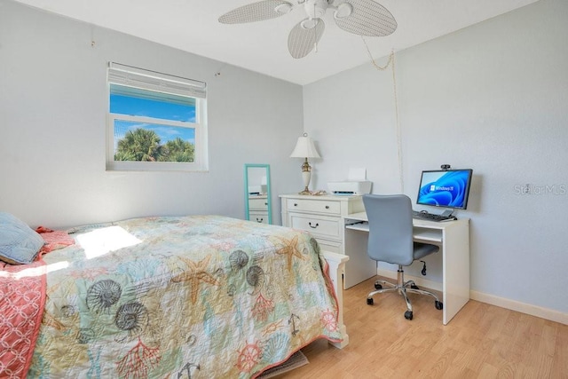 bedroom featuring baseboards, ceiling fan, and light wood-style floors