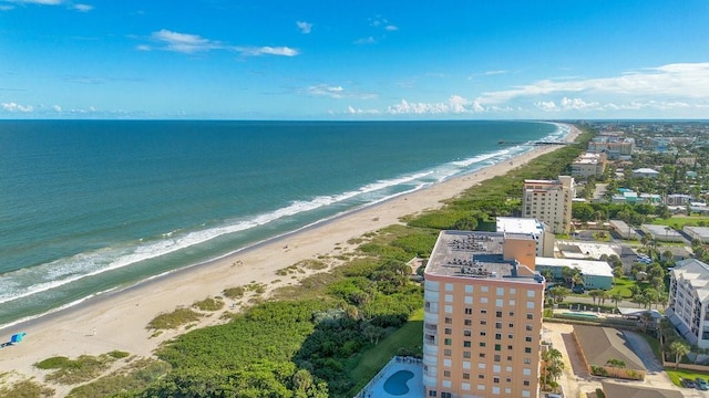 bird's eye view featuring a water view and a view of the beach