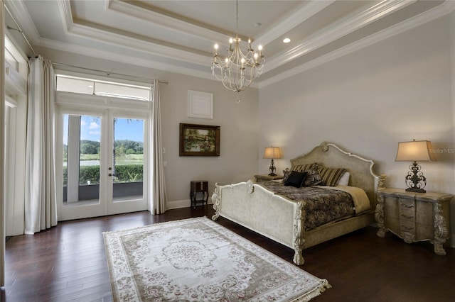 bedroom featuring crown molding, a tray ceiling, access to outside, and dark hardwood / wood-style flooring