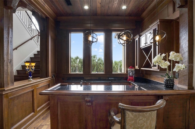 bar featuring pendant lighting, wooden ceiling, and hardwood / wood-style flooring