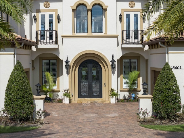 doorway to property with french doors and a balcony