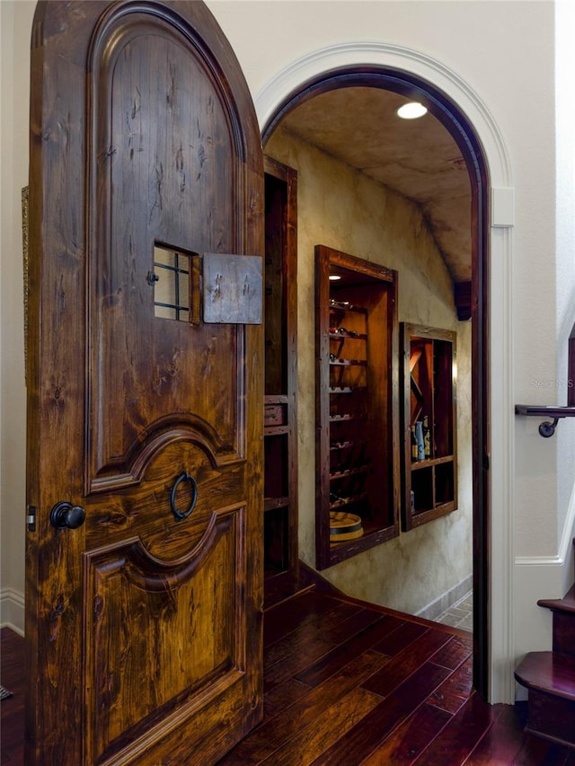 hall with dark hardwood / wood-style floors