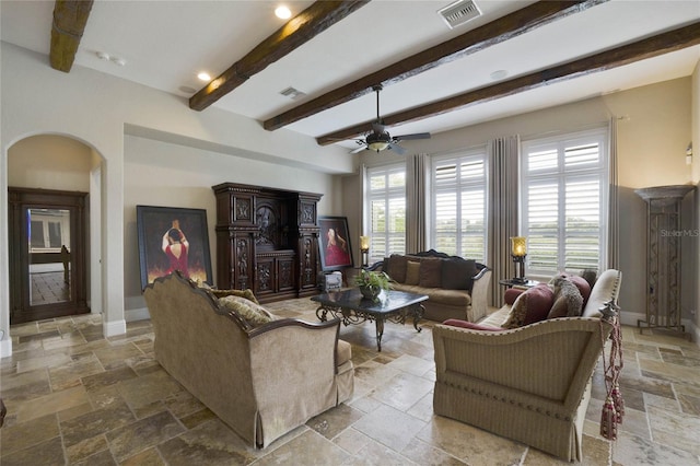 living room featuring beam ceiling and ceiling fan