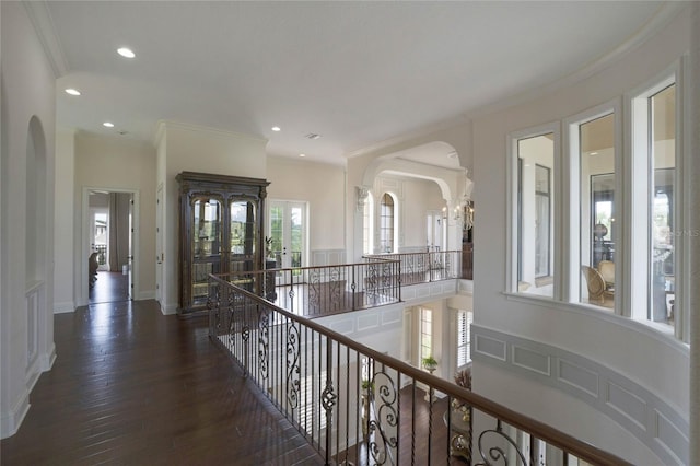 hall with french doors, dark hardwood / wood-style floors, ornamental molding, and a chandelier