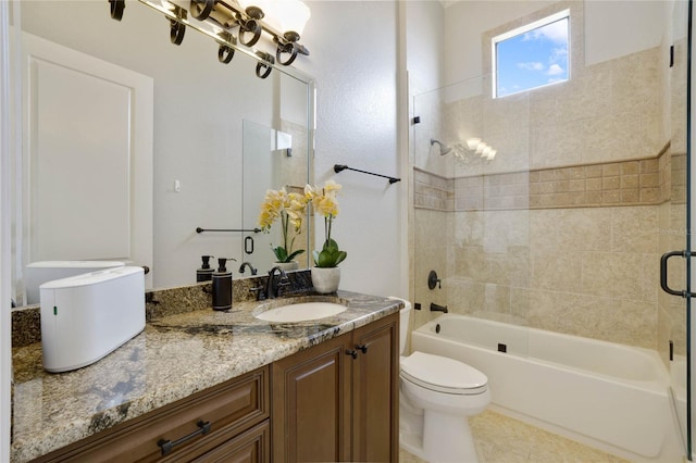 full bathroom with vanity, tile patterned flooring, toilet, and enclosed tub / shower combo