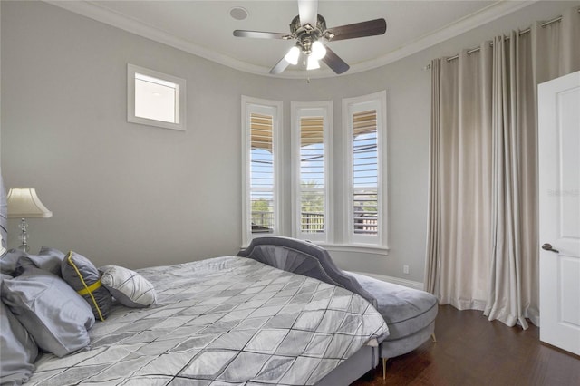 bedroom with wood-type flooring, crown molding, and ceiling fan