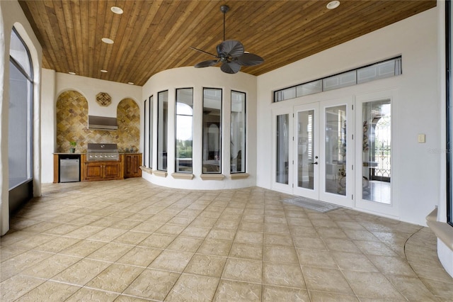 view of patio / terrace with an outdoor kitchen, ceiling fan, french doors, and a grill