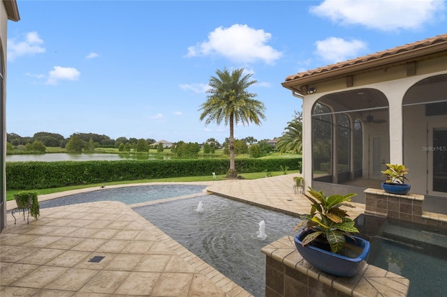 view of swimming pool featuring a water view and a patio area