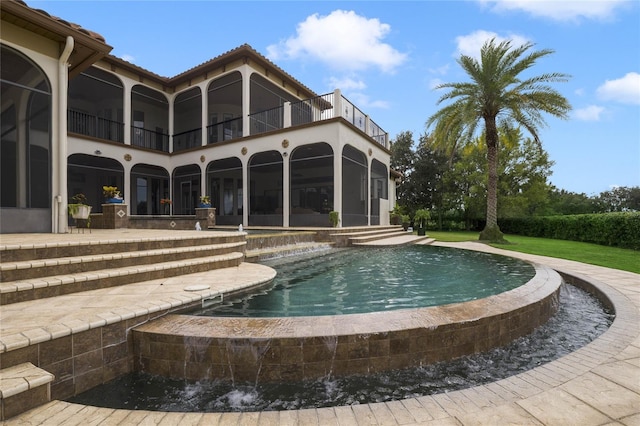 view of pool featuring a patio and a sunroom