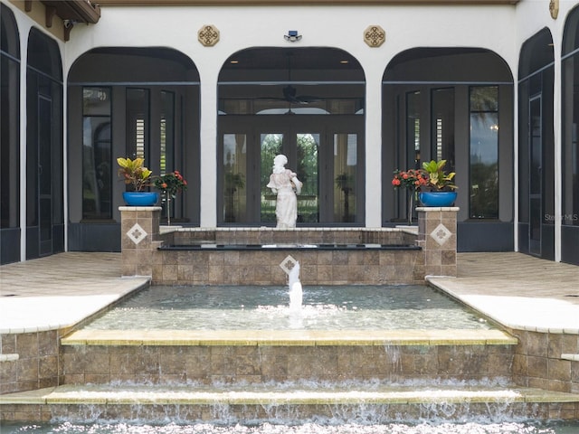 view of exterior entry featuring french doors