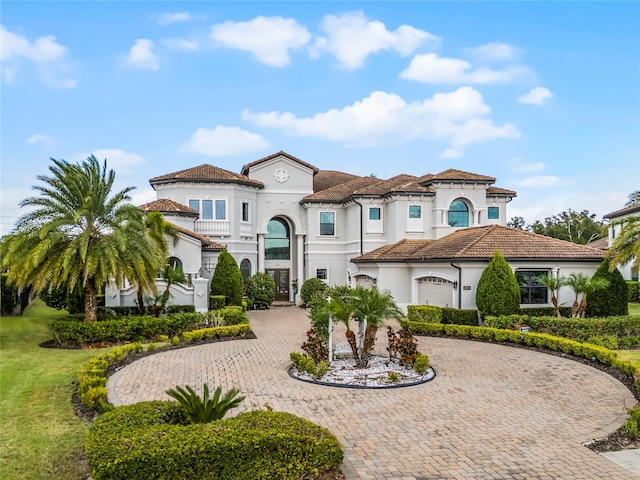 mediterranean / spanish-style home featuring a garage