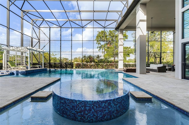 view of swimming pool featuring an outdoor hangout area, glass enclosure, pool water feature, a patio area, and an in ground hot tub