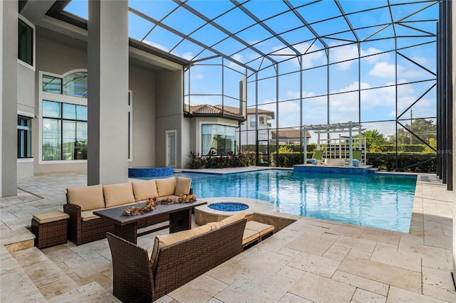 view of swimming pool featuring a patio, a lanai, and an outdoor hangout area