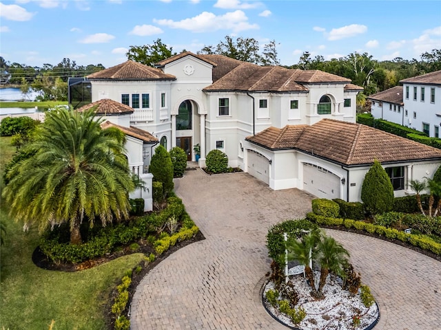 mediterranean / spanish home featuring a garage