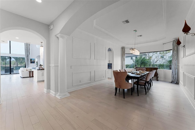 dining room with light hardwood / wood-style floors and plenty of natural light