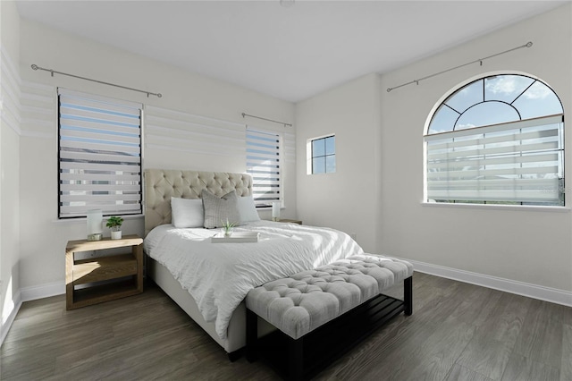 bedroom featuring dark wood-type flooring