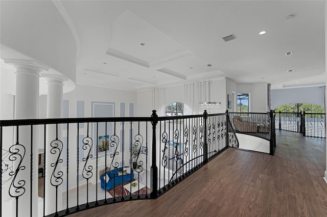 corridor with decorative columns, coffered ceiling, beamed ceiling, hardwood / wood-style flooring, and ornamental molding