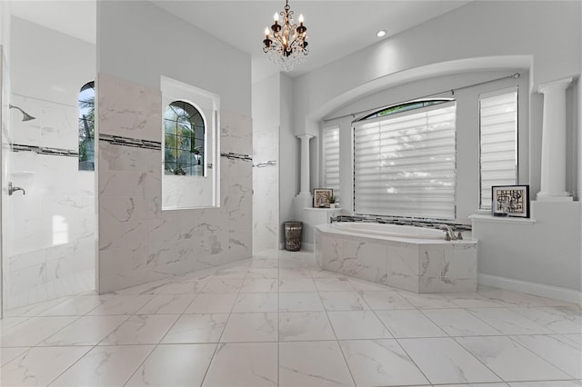 bathroom featuring a healthy amount of sunlight, decorative columns, a chandelier, and plus walk in shower