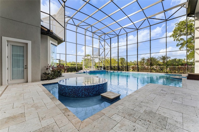 view of swimming pool featuring a patio area, a lanai, an in ground hot tub, and pool water feature