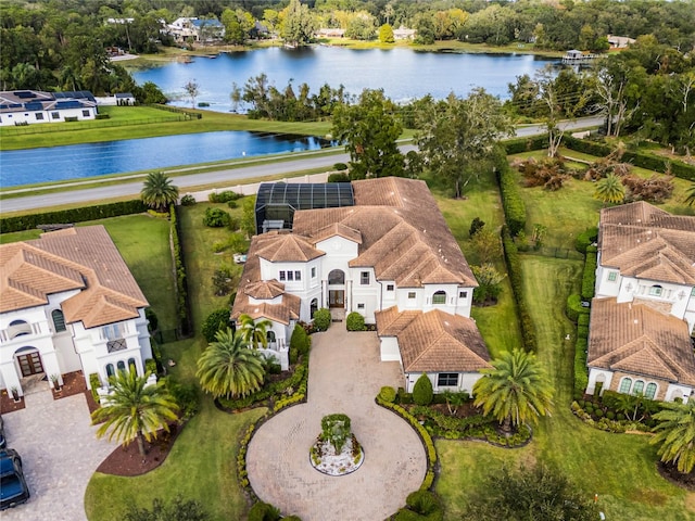 birds eye view of property with a water view