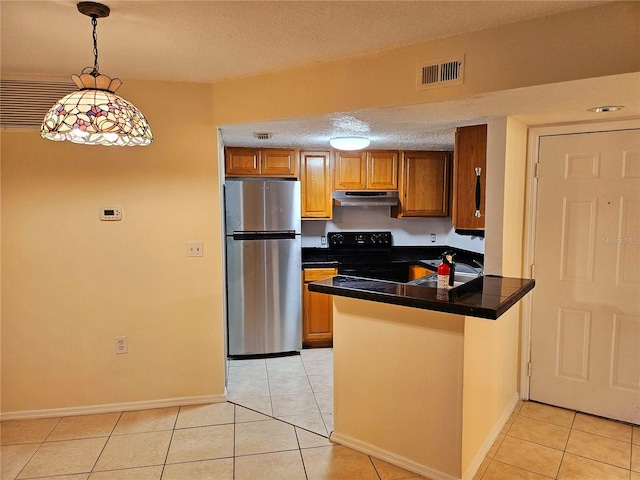 kitchen featuring light tile patterned flooring, hanging light fixtures, kitchen peninsula, stainless steel refrigerator, and electric range