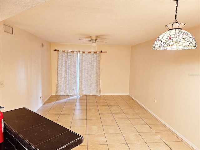 1916 Lake Atriums Cir Unit 25, Orlando, FL 32839 - empty room featuring a ceiling fan, light tile patterned flooring, baseboards, and a textured ceiling