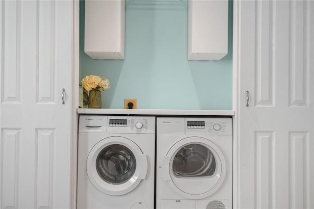 laundry room with separate washer and dryer