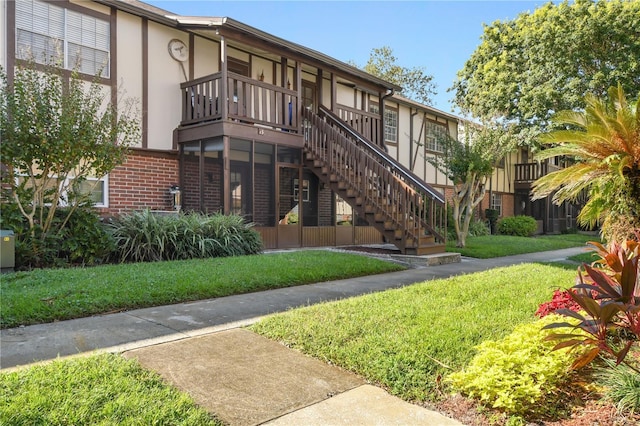 view of property featuring stairs