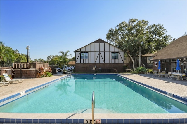 pool with a patio area